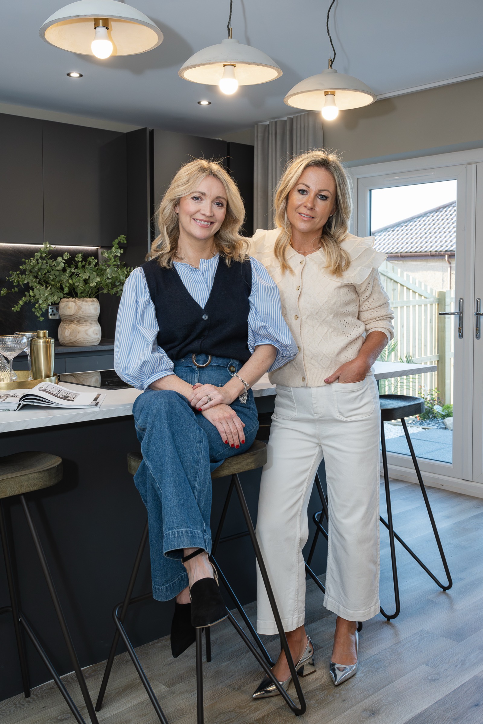 Caroline and Jane, photographed in a styled kitchen