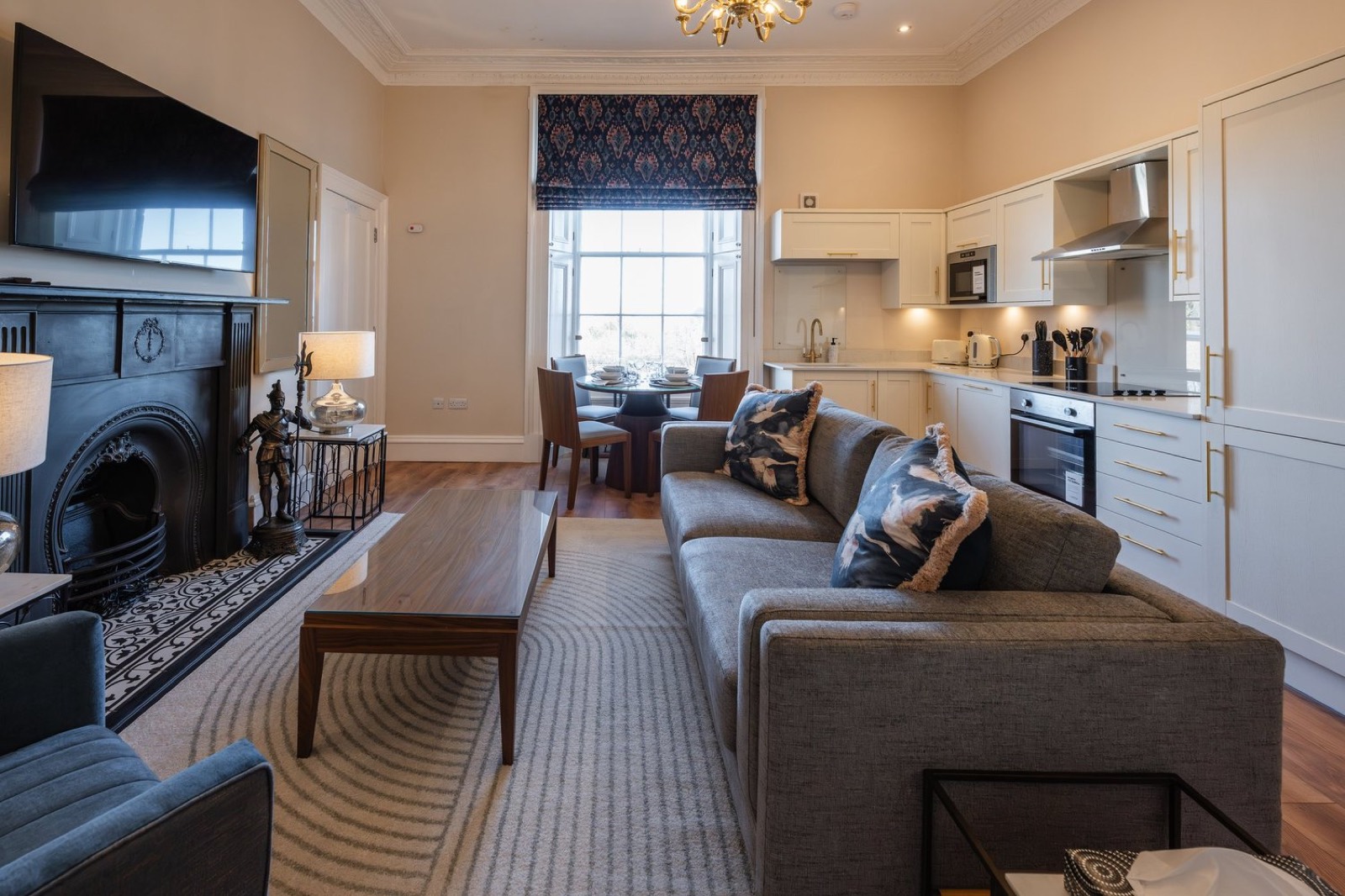 An open-plan sitting room with a fireplace