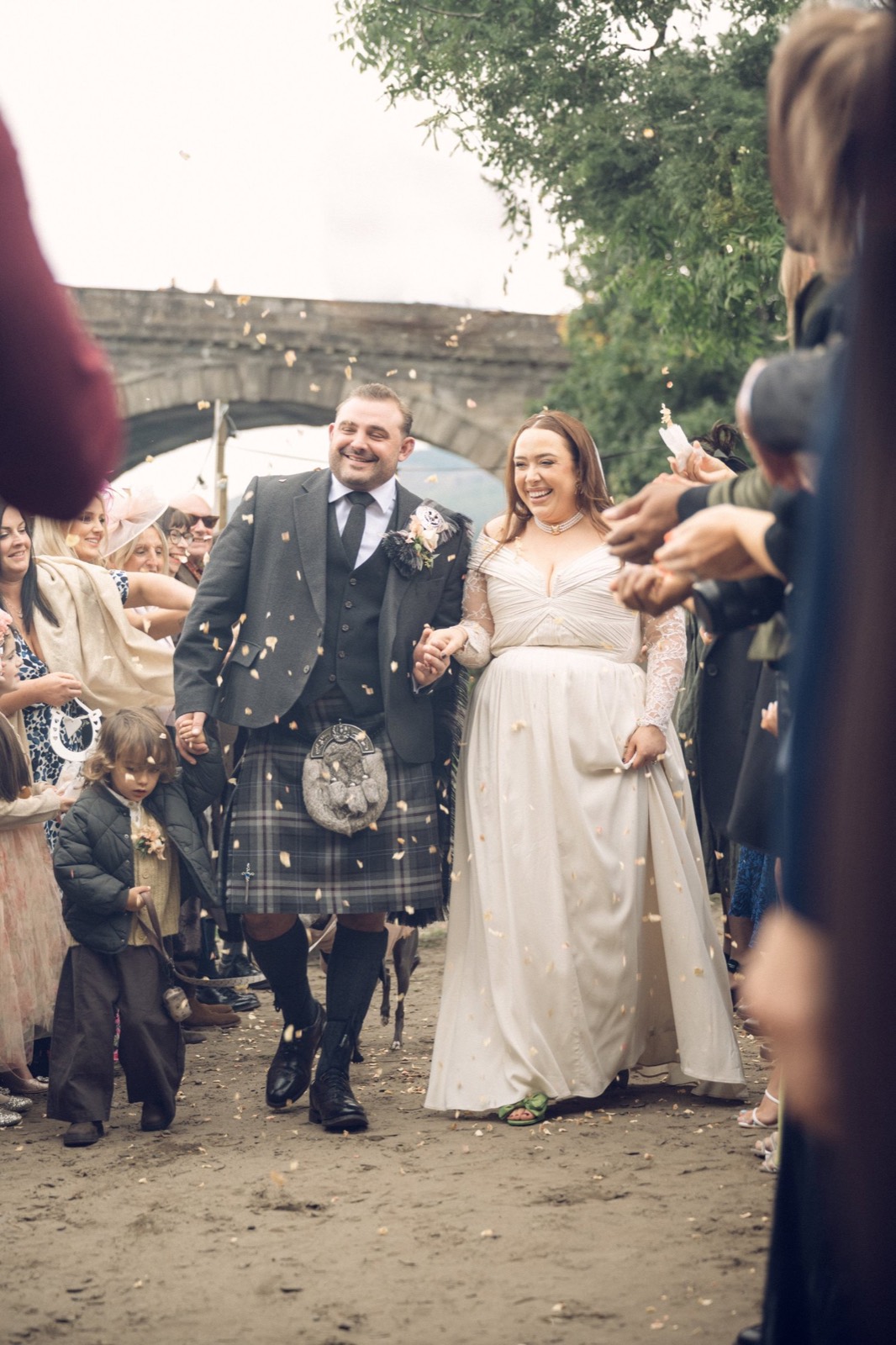 A bride and groom showered with confetti
